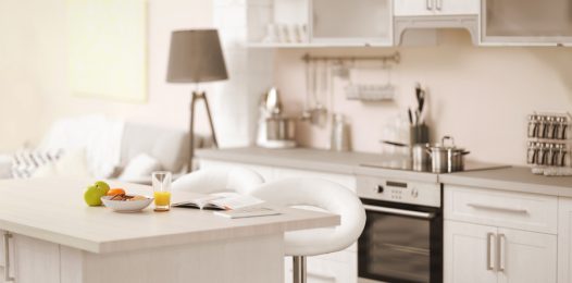 Image is of an all while kitchen in a smart home.