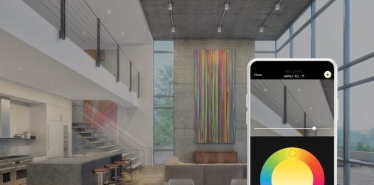Savant smartphone interface closeup in front of a luxury living room space