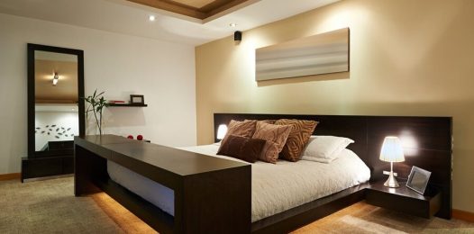 A bedroom illuminated by high-end lighting control fixtures.